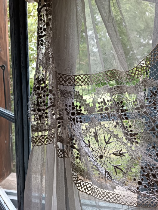 French Brocante - For Sale - Vintage Lace Curtain Panel for repurposing Description: <p>Such a pretty lace curtain but we tend not to use a central panel for windows now so this one may be best for gleaning or props</p>

<p>Made up of sections of soft tulle net and hand made crochet lace, it is hand sewn and would come apart quite easily</p>

<p> </p>

<p>Overall length is 260cm and width 140cm</p>

<p>Top net section 84cm, first band of lace 43cm, second band of net 77cm and the bottom scalloped lace hem 62cm</p>

<p> </p>

<p>It is clean and in good vintage condition, only a few brides strands broken in the centre section which are repairable </p>

<p> </p>

<p> </p>
