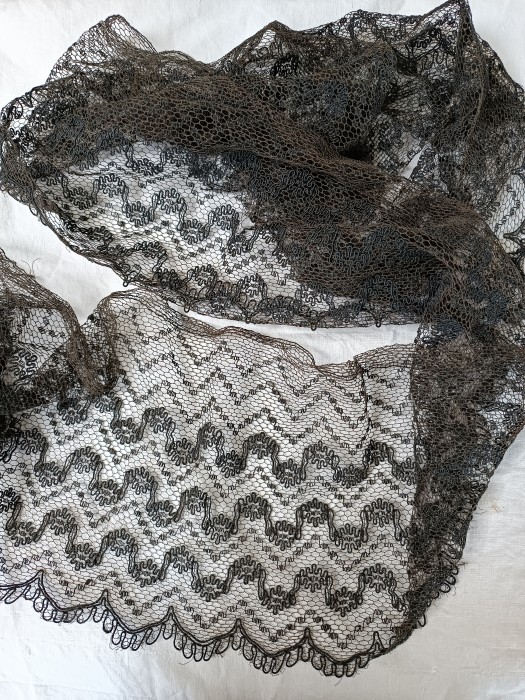 French Brocante - For Sale - 1900's black tulle trimDescription: <p>Late 19thc lace trim with a decorative cord woven through the tulle</p>

<p>200cm long, 22cm wide</p>

<p>Good condition, faded to an soft antique black</p>
