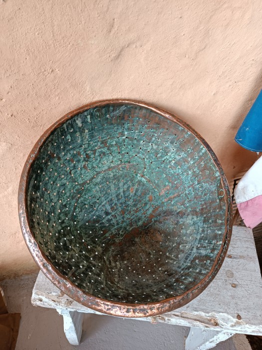 French Brocante - For Sale - Antique Hand Crafted Copper Colander or PassoireDescription: <p>French copper is everywhere at brocantes but occassionally you come across a piece that immediately stands out from the rest, this 19th century colander is one of those</p>

<p>These are rarities, I have only ever seen one other passoire, but not with the age and history that this one has</p>

<p>After a discussion with the seller we have settled on it being used for cheese making because of it's size, used to separate the curds from the whey</p>

<p>Hand crafted, the workmanship is a wonder, from the rolled top edging, the hand punched draining holes, the dove tale joints and shaping to create the curve needed, the copper rivets and the aged verdigris patina inside are a beauty to behold</p>

<p>As you can tell I love it!! Every inch displays it's age and history</p>

<p>The diameter is 38cm/15" and it weighs 2.4kg</p>
