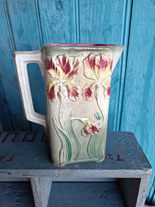 French Brocante - For Sale - Barbotine French Majolica Jug with Poppy DesignDescription: <p>6 1/2" high rectangular jug with a relief pattern of poppies (I believe) , good crackle effect</p>

<p>Some wear showing and a hairline crack in one side </p>
