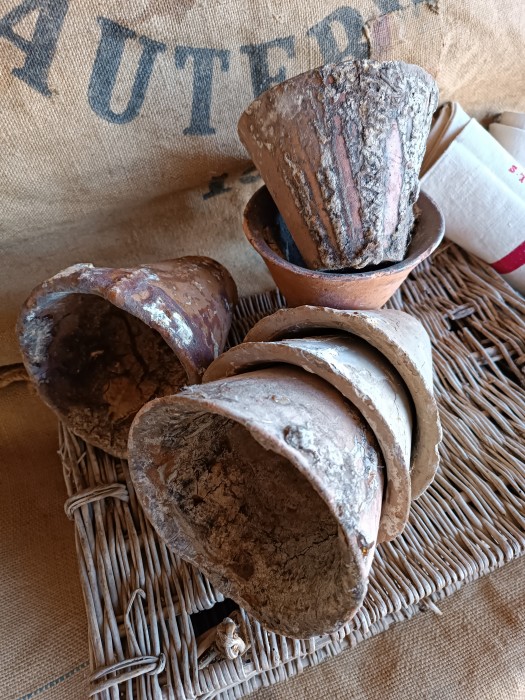 French Brocante - For Sale - One Antique 19thc Les Landes Region Terracotta Description: <p>In the Les Landes region to the west of us these hand thrown terracotta pots were used to tap pine resin for use in paints and varnish or to make turpentine</p>

<p>A cut was made in the bark and then these clay pots were tied underneath so the resin 'bled' into them</p>

<p>These are early ones, from the mid to late 19thc and some are caked in the resin which has hardened to look like amber</p>

<p>Fabulous decorative pots for the garden and home, price is for one of these pots, 18 available</p>

<p>Approximately 12cm/5" high, weight (re shipping) around 800g</p>
