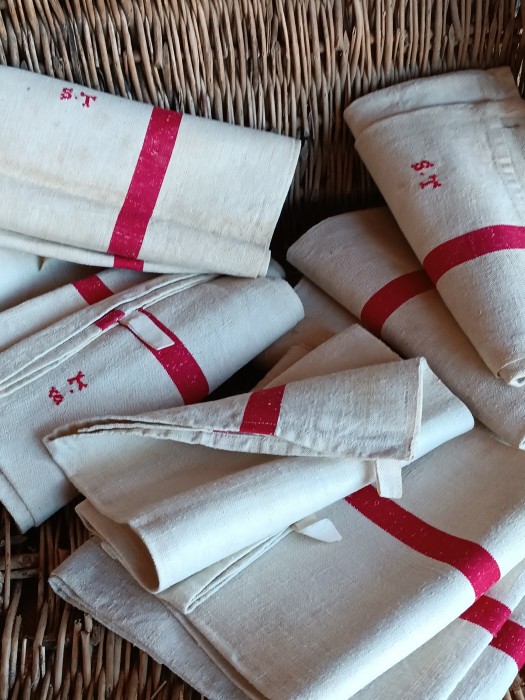 French Brocante - For Sale - One Pair of Traditional Red Stripe Linen Torchons Description: <p>Lovely batch of classic natural pure linen French torchons with a bold wide red stripe running down both sides and the original hanging tags, every one is hand embroidered with the initials ST</p>

<p>They are unused and straight from the farmhouse armoire, because of this unique as new feel they have been left as found and will need laundering</p>

<p>82cm by 58cm</p>

<p>Price is for two cloths, 4 pairs available</p>
