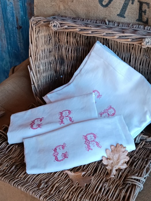 French Brocante - For Sale - Set of 12 Antique Heirloom Cotton ServiettesDescription: <p>So hard to find sets of 12 now, these early 1900's cotton napkins are lovingly embroidered with the initials in red cross stitch</p>

<p>They have a patterned chequerboard weave with narrow line borders</p>

<p>Well used but still with lots of life left in them, 5 have lovely make do and mend darns</p>

<p>They have had a refresh wash and could do with a a bit more detailing to remove the odd shaodow stain, depending on your preferences they would also benefit from a little starch</p>

<p>80cm by 72cm</p>
