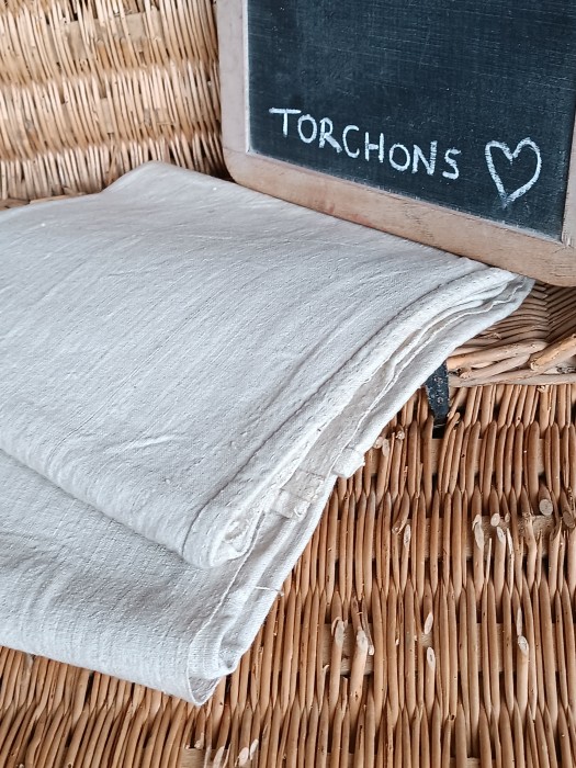 French Brocante - For Sale - Dark Antique Hemp Linen Torchon Cloth Description: <p>There are two of these wonderful antique 19thc hemp linen cloths, with a fabulous variagated weave that gives it an appearance of being striped</p>

<p>Difficult to say the purpose of these, most likely ham cloths as they are heavy and solid, the linen is quite beautiful</p>

<p>Each one is made up of four sections with hand sewn doubled over French seams, each section is approx 48cm by 45cm, overall they measure 98cm by 88cm</p>

<p>Price is for one cloth, two available</p>
