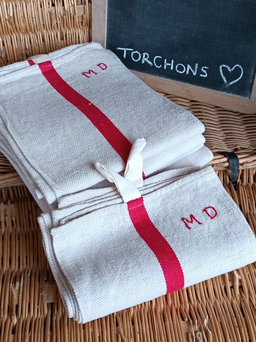 French Brocante - For Sale - Vintage Cotton Torchon Cloths, Wide Woven Red Description: <p>There are 5 of these classic French torchons, made from a natural coloured cotton with a lovely diagonal weave and rustic texture</p>

<p>They appear to be unused and each one has two hanging tags, one at each end and hand embroidered MD initial</p>

<p>Measurements 89cm by 59cm </p>

<p>Price is for one cloth, 5 available</p>
