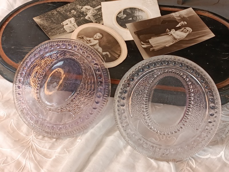 French Brocante - For Sale - Rare Amethyst Glass Grave DecorationsDescription: <p>Two rare moulded glass grave marker decorative plaques circa 1910's, these were mounted on the gravestone with the loved ones photograph in the centre domed vignette, they are similar but not a pair, the design slightly differs</p>

<p>The colour of the amethyst glass is beautiful, darker in one than the other but both stunning, they would like amazing remade into picture frames</p>
