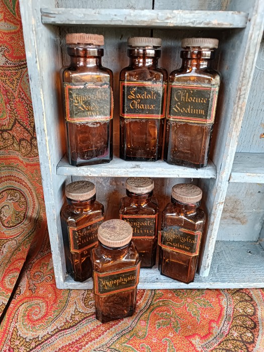 French Brocante - For Sale - Antique Pharmacy Glass Bottles Description: <p>Seven of these wonderful dark amber glass bottles for sale with superb original old labels made of some sort of black composite material with gilt script.</p>

<p>Each one has the original metal cap</p>

<p>We have removed the contents and given them a light clean</p>

<p>13.5cm high, there is some damage to the labels particularly on the quinine and the hyposulpahate</p>

<p>Price is for one bottle, once you have reserved the number required I will contact you so you can make your selection </p>
