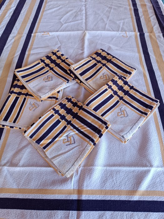 French Brocante - For Sale - Vintage Basque Stripe Tablecloth and Napkin Set Description: <p>Classic vintage 1920's/30's striped Basque table linen set, made in the traditional diamond weave of these regional textiles</p>

<p>The yellow and indigo blue stripes are woven into the fabric not printed</p>

<p>The tablecloth and each of the 5 napkins are hand embroidered with a JD monogram in yellow and grey</p>

<p>Cloth 234cm by 148cm, napkins 60cm by 56cm</p>

<p>I am selling these unlaundered, straight from the armoire due to pressure of work load, they only have storage staining, quite a bit of yellowing on a couple of the napkins and the cloth which will easily go with a soak and wash, otherwise they are in good condition</p>
