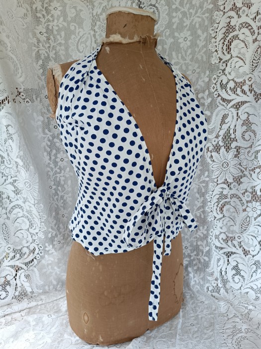 French Brocante - For Sale - True Vintage halter neck sun topDescription: <p>Halter neck top with simple ties at the front and good shaping in a white cotton with blue spots</p>

<p>waist 30", chest depends on how much you want to reveal but approx 34"</p>
