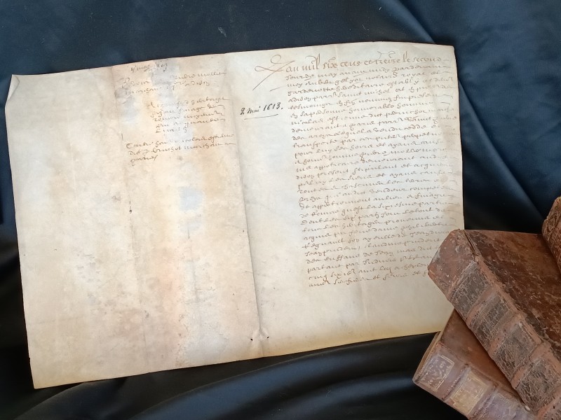 French Brocante - For Sale - 1613 Sepia Script on Vellum ManuscriptDescription: <p>French legal manuscript written in 1613, the date can be read at the top in words and then at a later date, but not recently, the date has been added in ink numerically </p>

<p>The wonderful swirling script is near impossible to read so we can't tell you what it contains, all four sides have some writing and there are two beautiful signatures</p>

<p>Laid flat open it measures 39cm by 27</p>
