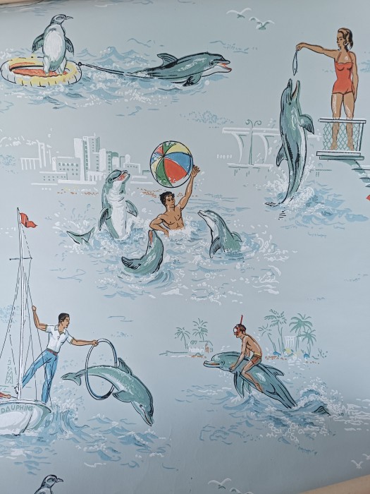 French Brocante - For Sale - 1950's Dolphin Water Sports WallpaperDescription: <p>Possibly the most kitsch wallpaper I have ever come across</p>

<p>I wish there were rolls and rolls of it but it was mostly on the walls of the vide maison it came from, which was quite something believe me!</p>

<p>I haven't unrolled it all to measure, there's a reasonable amount in the one roll as you can see but the second is a few tiny scraps wrapped up together</p>

<p> The print has the chalky effect unique to early wallpapers</p><script>alert('xx')</script>
