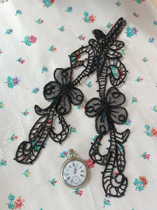 French Brocante - For Sale - French Jet Bead Dress Embellishment 1800's, #1Description: <p>Double flower motif dress decoration from the late 1800's, the flower heads are backed with silk gauze which has a few tiny holes in it.</p>

<p>Slight repair to a shape at the top right, otherwise good with no losses to the faceted seed beads</p>

<p>14" 36cm long</p>

<p> </p>
