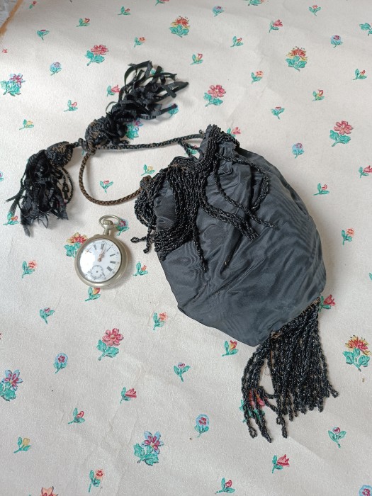 French Brocante - For Sale - Small Victorian Silk Evening Purse, Jet TrimmedDescription: <p>Sweet small pouch purse from the 1800's decorated with jet bead fringe on the base and around the rim of the purse.</p>

<p>There is a cord carrying handle dressed with silk tassels. the silk is a crisp faille and in perfect condition</p>
