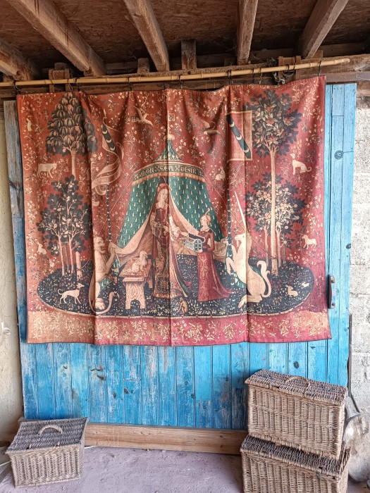 French Brocante - For Sale - Tapestry Style Vintage Wall Hanging Description: <p>Turn your petit maison into a medieval castle with this faux tapestry, it might not be the real thing but it does have some age, is French made and will be quite a statement as a wall hanging or even a bed coverlet,&nbsp;printed heavy weight cotton lined with a plain red cotton which is stamped Made in France, the rings and tape at the top help to date it, my estimate&nbsp;is early half of the 20thc, quite clean, just&nbsp; a little dusty, 73" across, 54" long, 186cm by 136cm</p>

<p>&nbsp;</p>
