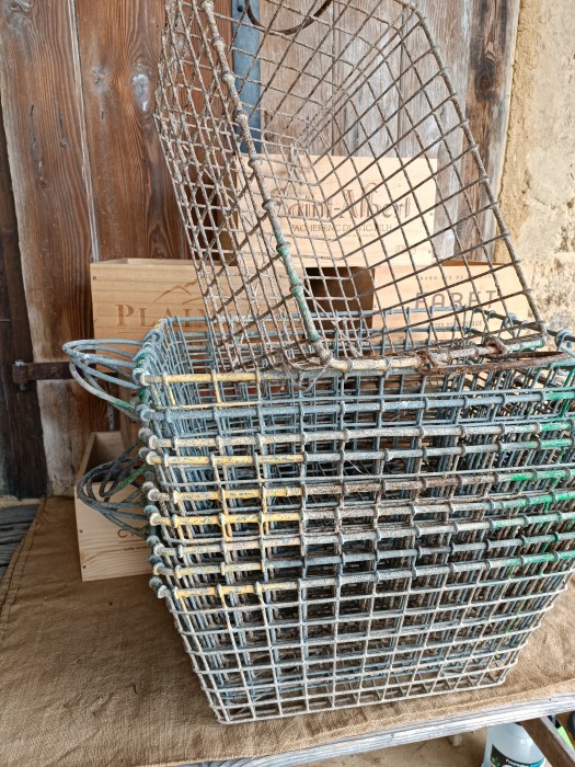 French Brocante - For Sale - Vintage Oyster BasketsDescription: <p>Large steel baskets used for the production of oysters in the Archichon region, these are particularly beautiful as they have a fabulous bloom from wear in the salty water and a hint of colour with the yellow and green paint, there are handles on the sides, great for storage and display of textiles and Brocante finds</p>
