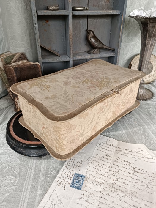 French Brocante - For Sale - Romantic Fabric Covered Boudoir BoxDescription: <p>One of the most beautiful fabric boxes I've seen, that art nouveau fabric must have been a stunner when it was new, now rather faded on the outside you can appreciate how vibrant it would have been on opening the lid, can you imagine it with the velour edging still that shade of purple to match the flowers, the outside has some foxing, maybe some sort of fastener is missing however it's intact with no damage to the fabric and it has a sort of faded grandeur style perfect for a boudoir decor, 38cm x 23cm x 11cm</p>

<p>&nbsp;</p>
