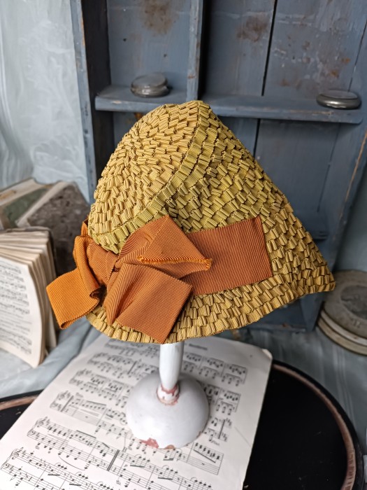 French Brocante - For Sale - Vintage 1940's Chapeau Description: <p>An unusual millinery confection cleverly made from a gathered and pleated narrow grosgrain ribbon, it's very small however I think from the materials used this may date from the 1940's and hats then seem to perch on the front of coiffures rather than pulled down on the head so it is probably for a woman rather than child especially as it seems a fashion hat, in excellent condition, the colour is more mustard&nbsp;</p>

<p>&nbsp;</p>
