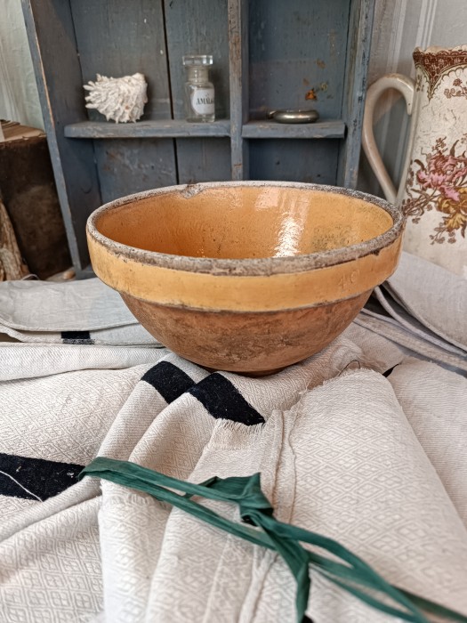French Brocante - For Sale - Farmhouse Terracotta BowlDescription: <p>Small antique 19th century terracotta bowl with the classic dark yellow glaze to the rim and interior, it has a rustic aged patina from decades of regular use, staining and chips in the glaze, perfect imperfections, diameter 20cm 8"</p>

<p>&nbsp;</p>
