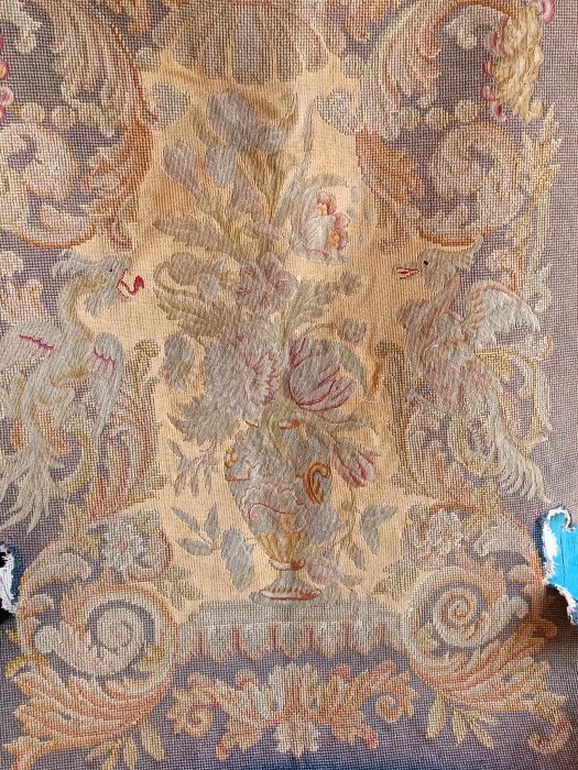 French Brocante - For Sale - Heraldic Tapestry Seat Cover c 1850Description: <p>The very detailed work and tiny stitching in this antique hand made tapestry is what make it special, a textile work of art full of faded grandeur.</p>

<p>Formally a seat back on a large chair it has cut outs for the positioning of the arms and you can see where it is less&nbsp;faded where the base was tucked behind&nbsp;the seat pad,&nbsp;it without doubt came from a piece of chateau furniture.</p>

<p>The pictorial part is in excellent condition with no losses but there is some damage around the border</p>

<p>An amazing antique textile to frame, hang on the wall as decor or make into a decorative pillow</p>

<p>Measures 69cm by 92cm 27" by 36"&nbsp;</p>

<p>&nbsp;</p>
