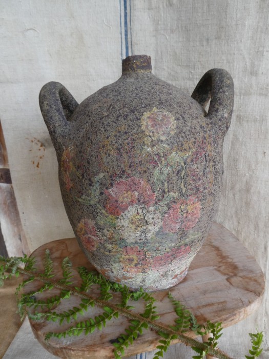 French Brocante - For Sale - 1800's Pottery Wine/Water/Oil Carafe JugDescription: <p>We love the patina on this late 1800's double handled terracotta pottery jug or carafe wich would have been used to store wine, vinegar or oil or used as a water carrier</p>

<p>The slip glaze has crackled and produced a wonderful flaky effect, along with the gently faded original flower painted decoration it is shabby chic perfection</p>

<p>In good condition with no chips or cracks</p>

<p>26cm high</p>
