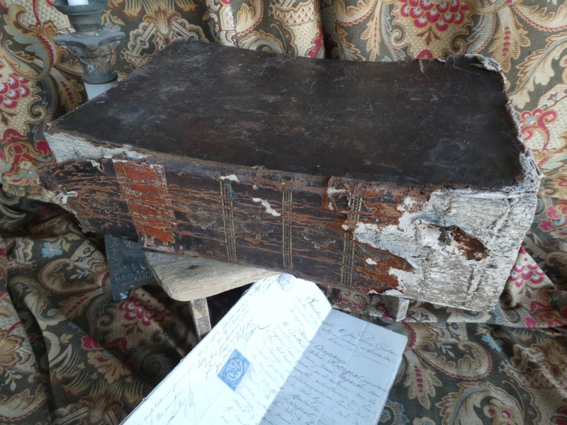 French Brocante - For Sale - Large Antiquarian Book for PropsDescription: <p>Fabulous antiquarian book for props, looks like a book of spells from a horror movie, with an amazing aged leather cover and spine with gilt decoration, perfectly distressed for supporting favourite antique treasures</p>

<p>It is a religious tome dated 1656, inside it has a few pages of illustrations and a couple of hidden treasures tucked away many, many years ago by the previous owners but prhaps we will leave you to find those yourself</p>

<p>Measures 37cm by 24cm and is 12cm thick. It weighs 45.3kg which you will need to take into account for shipping but if you are combining with other items it will still be practical to ship </p>
