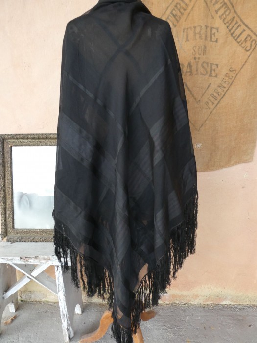 French Brocante - For Sale - Edwardian Jacquard Silk Chiffon Piano Shawl Description: <p>Light and delicate late 1800's/turn of the century piano shawl with long fringe in good enough condition to wear for a costume event and also beautiful to use for décor</p>

<p>The silk is woven with a plaid pattern, some bands lightly ribbed and between them 3 bands of a contrasting colour that looks a very dark red when held up to the light, the effect is exquisite</p>

<p>This was probably made for wear during the mourning period</p>

<p>Measures 160cm by 150cm, one very small hole, not cleaned</p>
