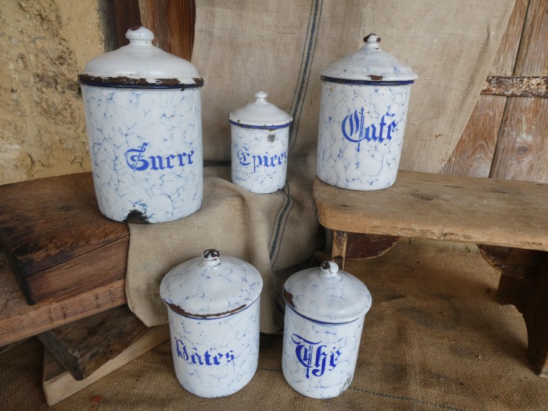 French Brocante - For Sale - Set of Vintage Enamel Kitchen CanistersDescription: <p>Traditional set of storage canister in blue and white marble incorporating enamel labelling</p>

<p>Slightly chippy but not too battered, the lids on the Sucre and Epices may not be original, they fit perfectly but they are plain white, if they were replaced it was a long time ago because when I found them the dust and grease was so thick on the lids I didn't notice the difference until they were washed</p>

<p> </p>
