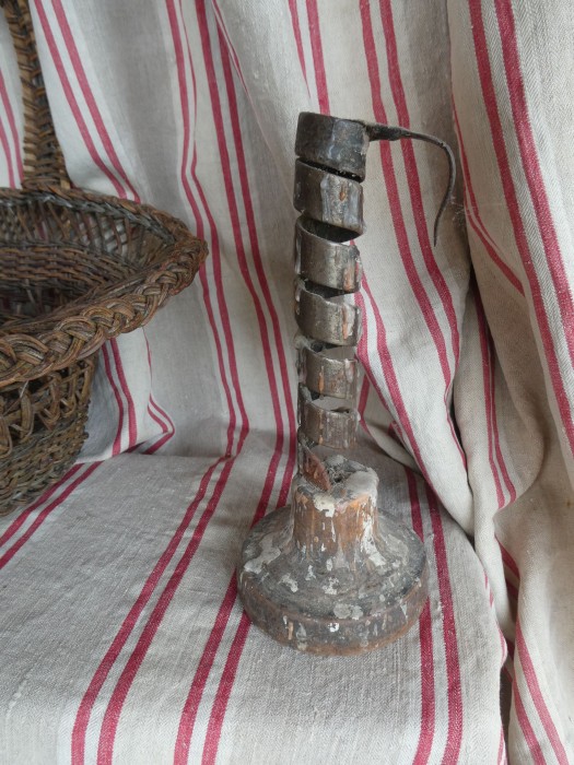 French Brocante - For Sale - 18th Century Rat de Cave CandlestickDescription: <p>A rare brocante find these days, this hand forged wrought iron candlestick on a hand turned wooden base was traditionally used to light a passage into the wine cellar</p>

<p>The hook at the top was used both to carry the candlestick and to hook it on the wall in the cave</p>

<p>As usual we have decided to leave it as we found it, complete with dribbles of old candle wax</p>

<p> </p>
