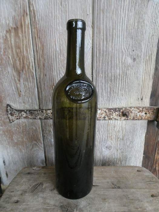 French Brocante - For Sale - Original Chateau Lafitte Wine Bottle 1903Description: <p>Super original wine bottle from the famous wine producer Chateau Lafitte with the medallion at the top marked with the date 1903</p>

<p>The bottle is thick and heavy hand blown glass with lots of imperfections and a rich deep green colour, the base has a deep pontil for the thumb to sit when pouring</p>

<p>Sadly no contents, if it was full the price would be around 4000€, without contents it would make a fun water carafe for the dining table or flower vase</p>
